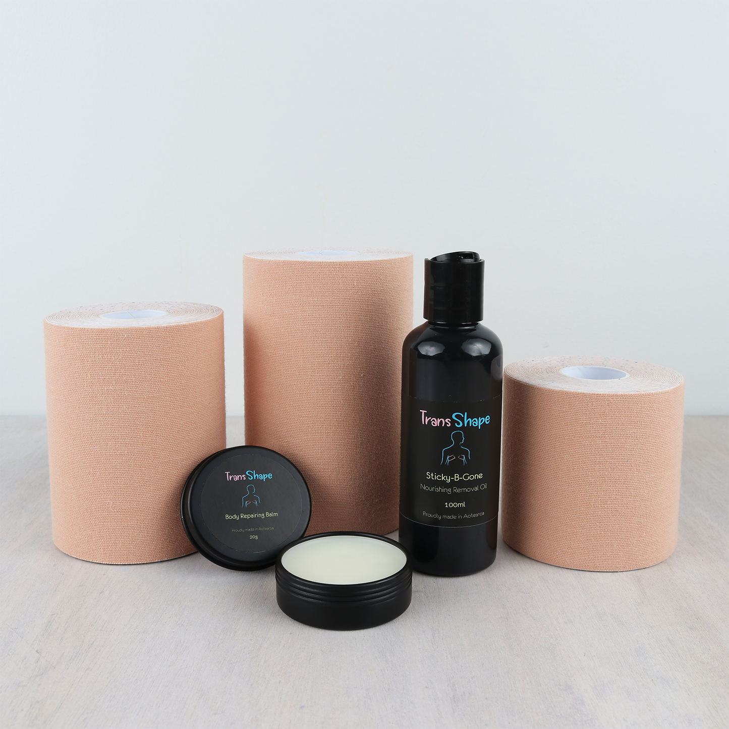 TransShape, Trans, Tape, Transgender, Transtape, Flatten, Chest, Breast, Boob, Body, Wrap, Binding, Top, Tank, Garment, Binder, Packing, Sticky, B, Gone, Nourishing, Removal, Oil, Skincare, Skin, Care, Repair, Remove, Repair, Balm, Masculine, Male, Man, Feminine, Female, Woman, Non, Binary, Intersex, Inter, Sex, MTF, FTM, Undisclosed, Gender, Poly, Pan, Queer, Neutral, Fluid, Diverse, Affirming, ENBY, Agender, Dysphoria, Bi, AMAB, AFAB